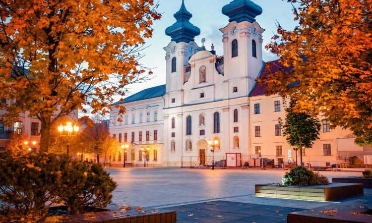 Astonishing evening view of Gyor Benedictine Church of St. Ignatius of Loyola. Beautiful autumn cityscape of Gyor town, capital of Gyor-Moson-Sopron County and Western Transdanubia region, Hungary.