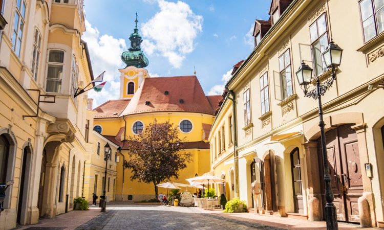 The Carmelite church seen from the street in the downtown of Gyor, Hungary